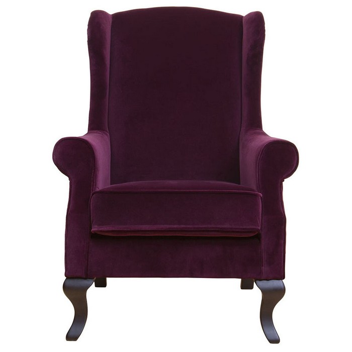 La chaise est en velours bordeaux